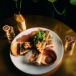 Sobre Mesa’s signature Day Rum with Roasted Bone Marrow (pickled cassava | baguette crostini | jerk chimichurri | smoked sea salt)